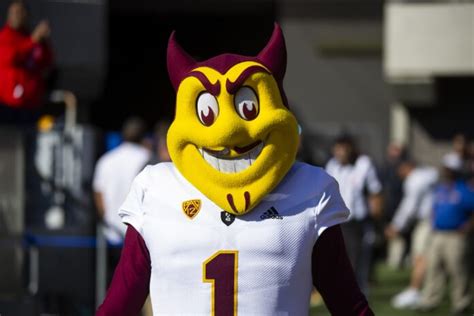 An Arizona State Football Mascot Wearing A Maroon Uniform