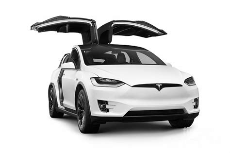 Photo Of White Tesla X Luxury Suv Electric Car With Open Falcon Wing Photo Of White Tesla X Luxury Suv Electric Car With Open Falcon Wing